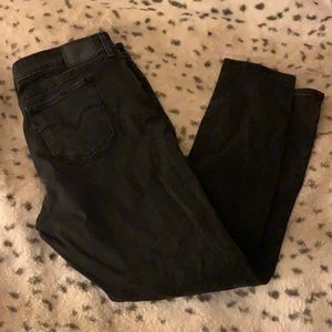 Levi’s 711 Black Distressed Skinny Jeans
